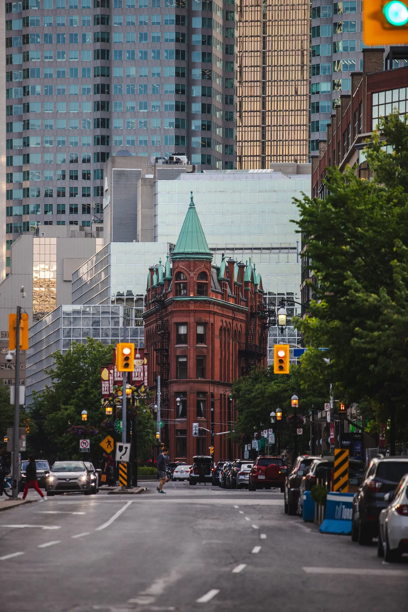 The Gooderham Flatiron building with its copper turret against the Toronto financial district